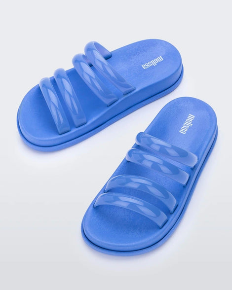 Top view of a pair of Blue Melissa Soft Wave Slides with 4 front straps.