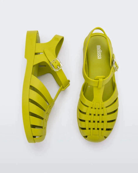 A top and side view of a pair of moss green Melissa Possession sandals with several straps and a closed toe front.