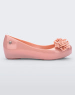 Side view of a light pink Mini Melissa Ultragirl Garden flat with two rose details on the toe.