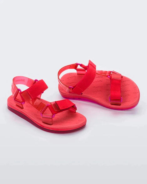 Angled view of a pair of red Melissa Papete sandals.