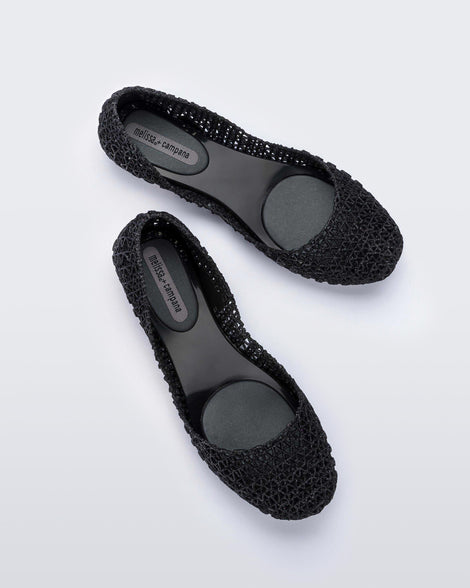 Top view of a pair of black Melissa Campana ballet flats.