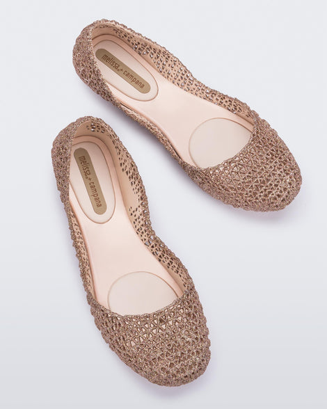 Top view of a pair of pink Melissa Campana ballet flats.