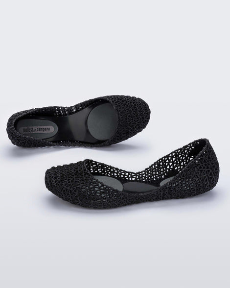 Top and angled view of a pair of black Melissa Campana ballet flats.