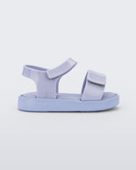 Side view of a purple Mini Melissa Jump sandal with velcro straps.