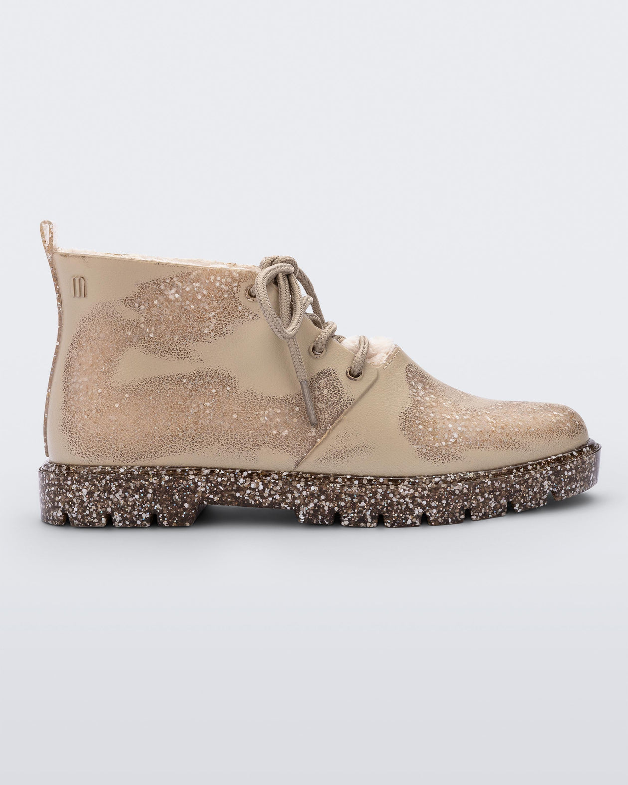 Side view of a Beige Flecked/Glitter Melissa Fluffy Boot with laces and a rubber sole.